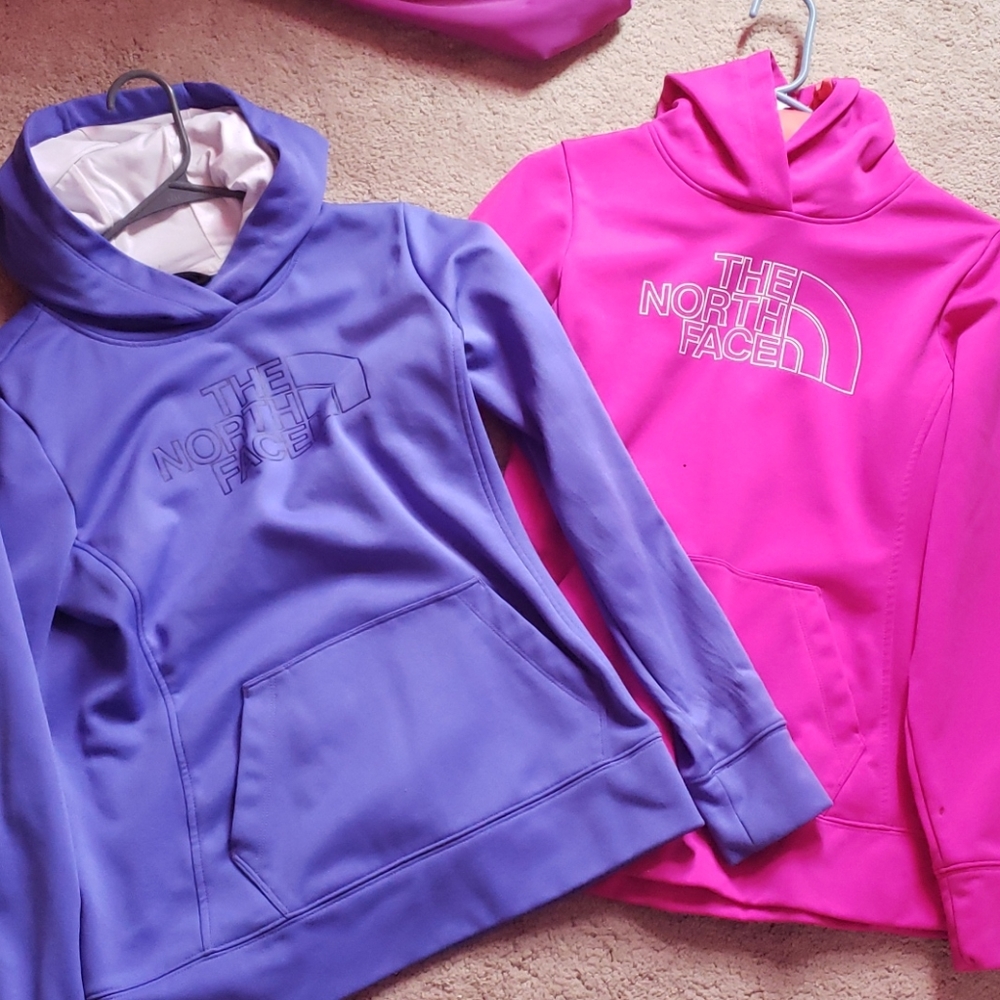 Purple and pink north face hoodies